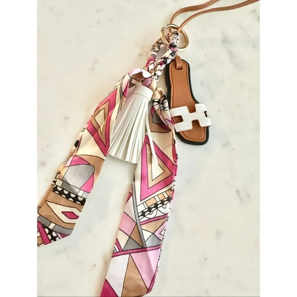 White purse charm flip-flop and pattern scarf